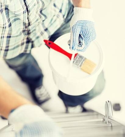 interior-design-home-renovation-concept-man-with-paintbrush-paint-pot-climbing-ladder_380164-86651